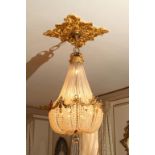 *Pair of French Crystal Chandeliers ormolu and silver decoration. 48"h x 30"w Very good condition
