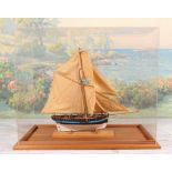 Single Masted 20th c Ship Model in plexiglass case with full sails. Good