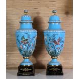 Pair Late 19th c Covered Celeste Blue Glass Vases of shield shape and high doomed covers with ball