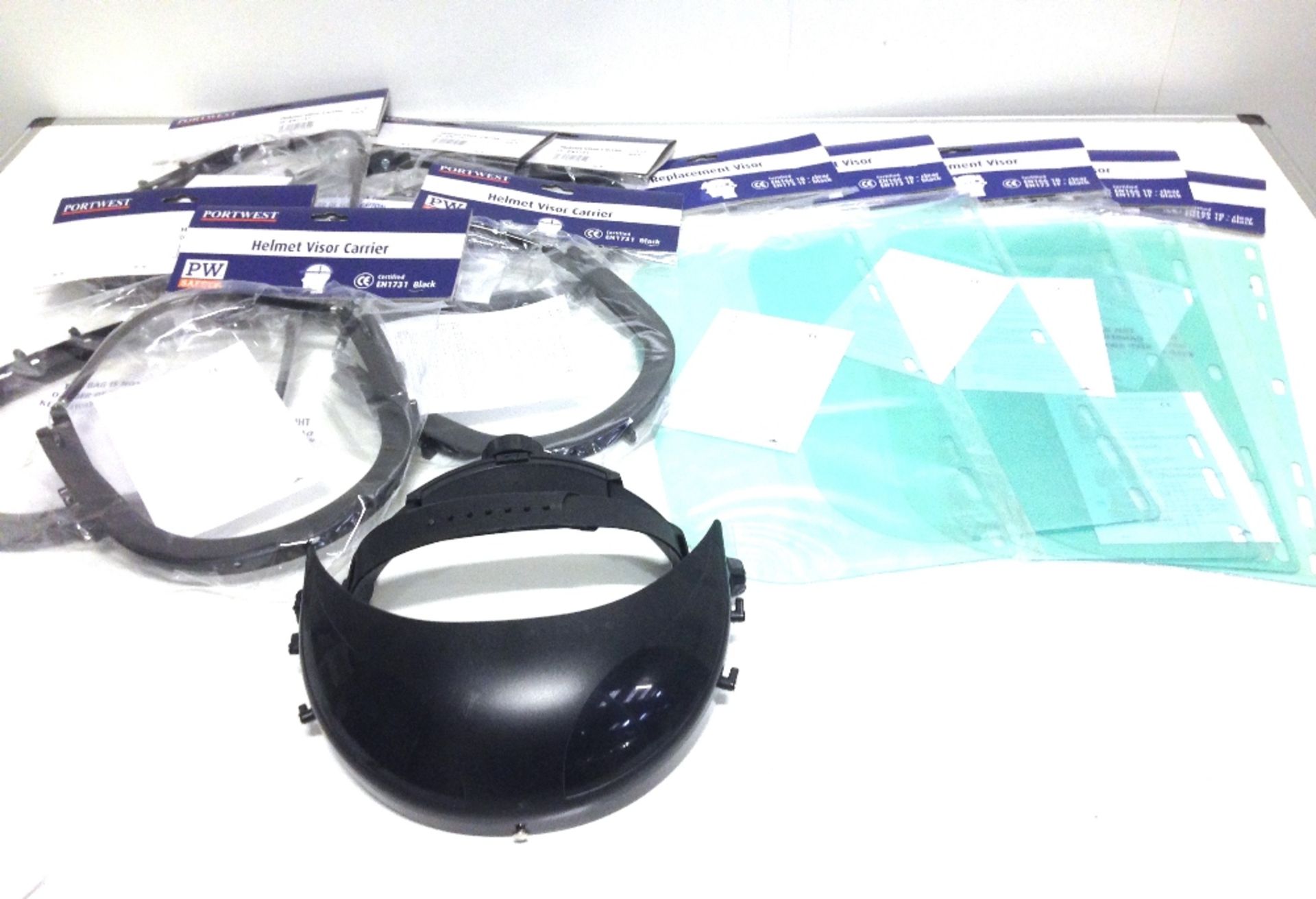 7 x Helmet visor carriers and 5 x replacement visors