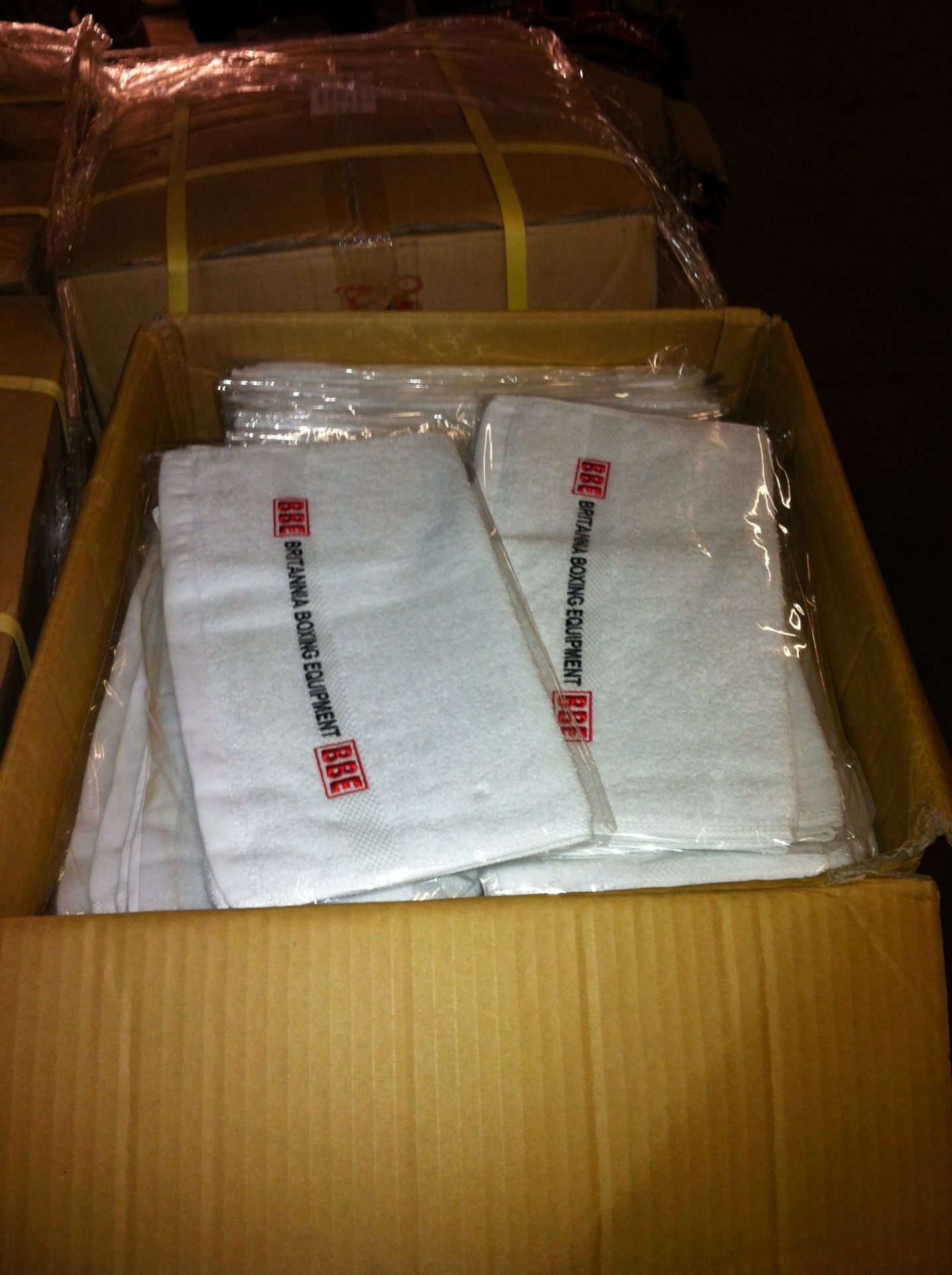 Box containing approximately 120 BBE Boxing.com towels