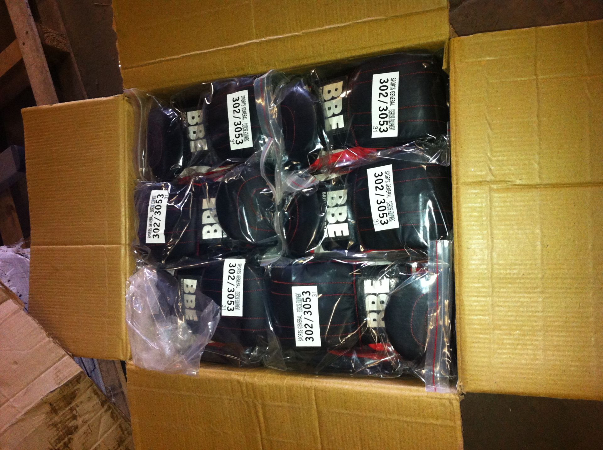 Approximately 125 BBE boxing gloves in opened box