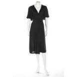 An Ossie Clark black crêpe wrap-around dress with satin facings, circa 1973, Radley labelled,