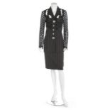 A Gianni Versace dark grey pin-striped suit with lace shoulders and sleeves, circa 1990,