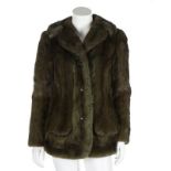 A Christian Dior Paris dyed green mink jacket, 1970s, labelled, with concave metal buttons,