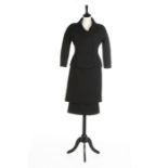 A Balenciaga couture black wool suit, circa 1956, Paris labelled and numbered 56711,