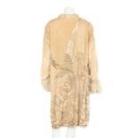 A lavishly beaded ivory velvet opera coat, 1920s, indistinguishable label,