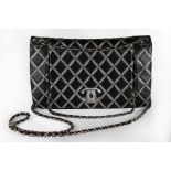 A Chanel black and silver quilted leather bag, modern, stamped to interior,