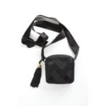 A Chanel black satin ribbon mini-bag, 1990s, stamped to interior, with gilt and tassel pendant,