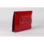 An Alexander McQueen red mock-croc leather handbag, 2000s, maker's stamp to the interior,