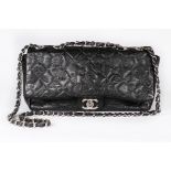 A Chanel black embossed leather handbag, modern, stamped to interior,