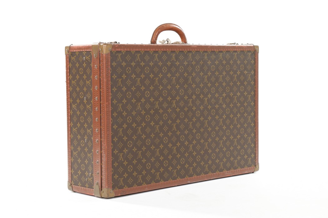 A Louis Vuitton monogrammed hard-sided suitcase, probably 1950s, with leather binding, - Image 2 of 8