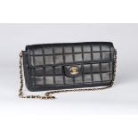 A Chanel quilted black leather slim shoulder bag, 1980s, stamped to interior and numbered 7446471,