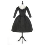 A Christian Dior couture black faille cocktail dress, 'Fuseau' (Spindle) line, Autumn-Winter, 1957,