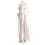 A Maggy Rouff couture ice-white satin sheath, circa 1949, labelled, with integral corset,