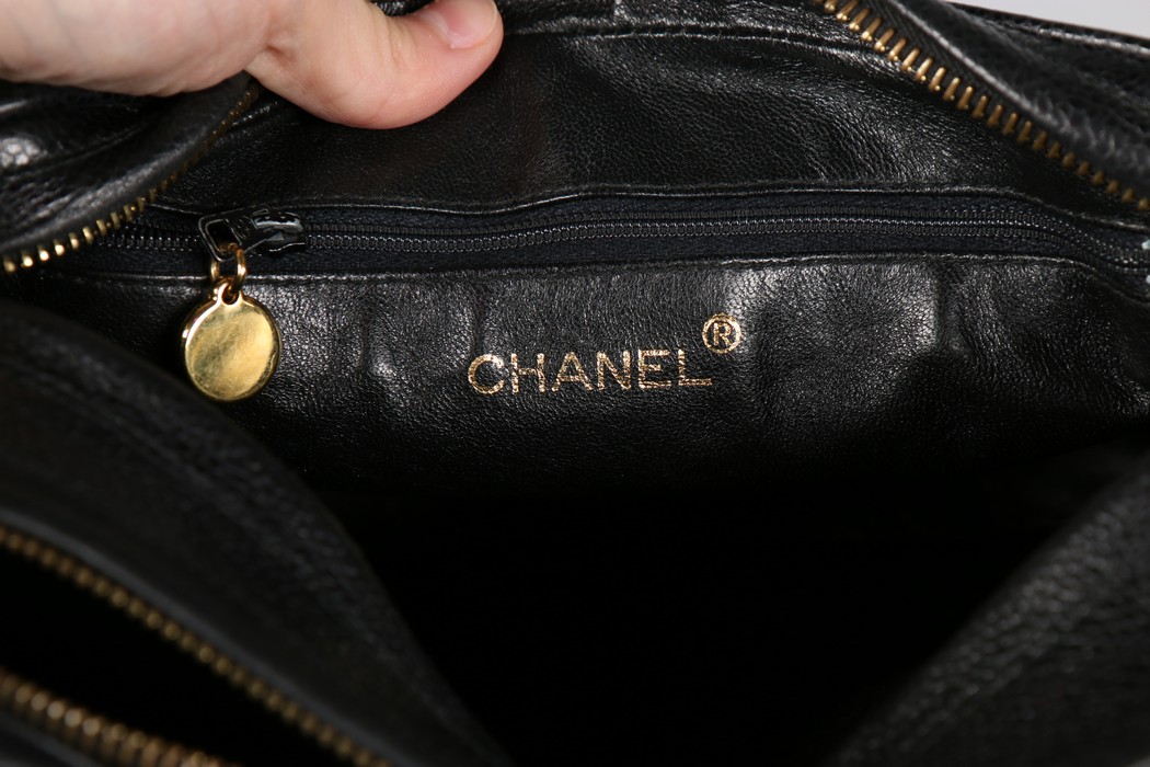 A Chanel caviar leather quilted shoulder bag, 1980s, stamped to interior, with two gilt pendants, - Image 5 of 7