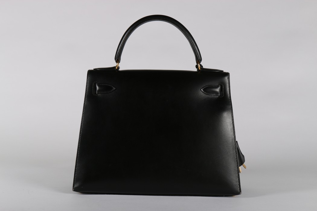An Hermès black leather Kelly bag, 1993, blind stamp W, with gold-plated metal hardware, - Image 4 of 8