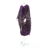 A Hitchens of New York embroidered purple velvet opera cape, circa 1910, large woven label,