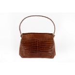 The Duchess of Windsor's brown alligator handbag, probably Ferest, 1950s,