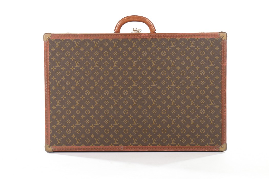 A Louis Vuitton monogrammed hard-sided suitcase, probably 1950s, with leather binding, - Image 3 of 8