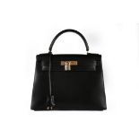 An Hermès black leather Kelly bag, 1993, blind stamp W, with gold-plated metal hardware,