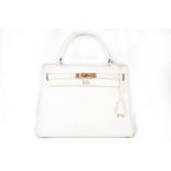 An Hermès white leather Kelly bag, 1972, signed 'Hermes Paris', with gilt hardware,