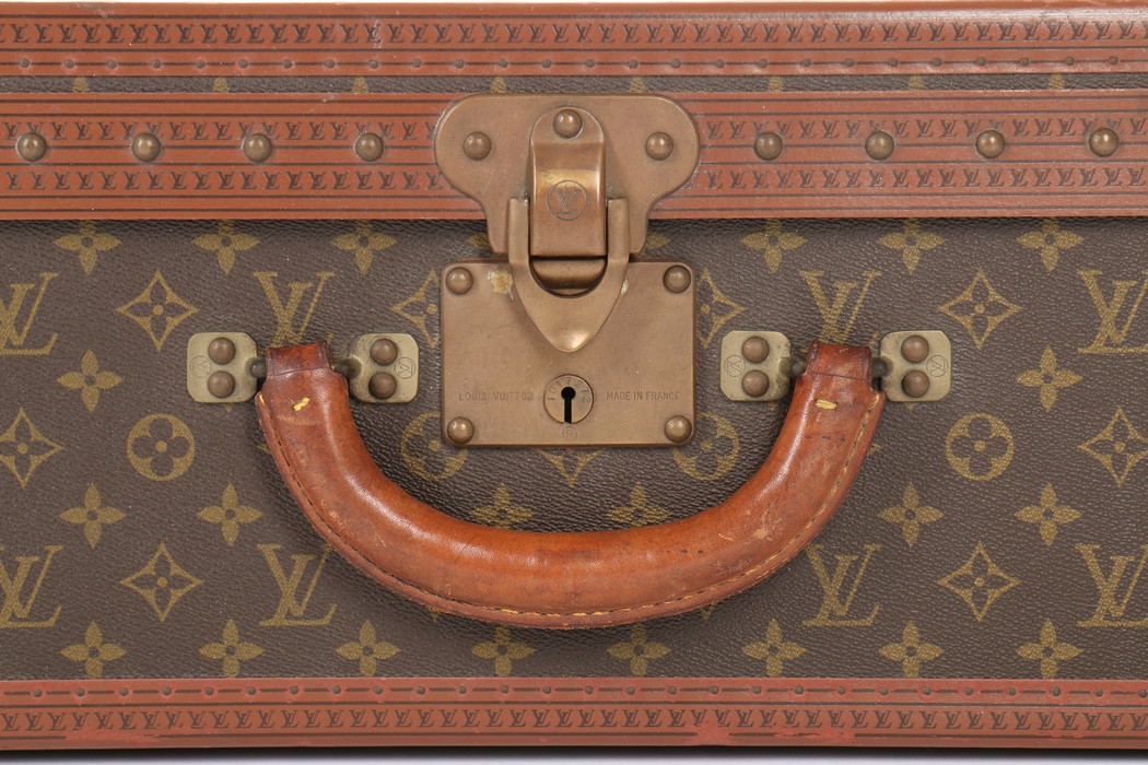 A Louis Vuitton monogrammed hard-sided suitcase, probably 1950s, with leather binding, - Image 6 of 8
