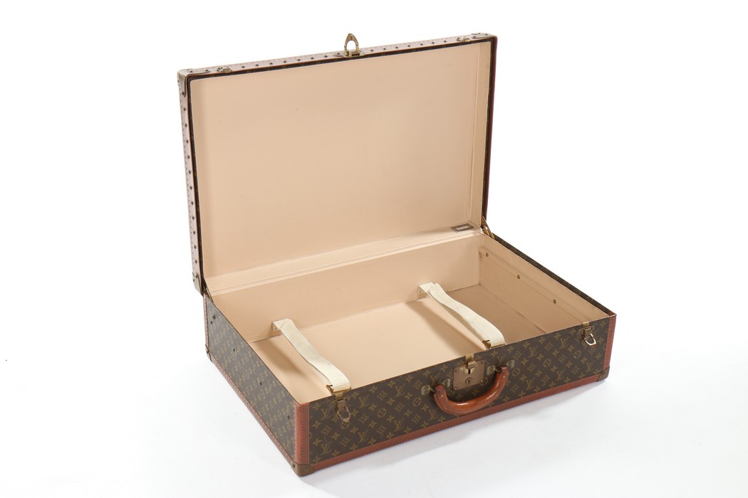 A Louis Vuitton monogrammed hard-sided suitcase, probably 1950s, with leather binding, - Image 4 of 8