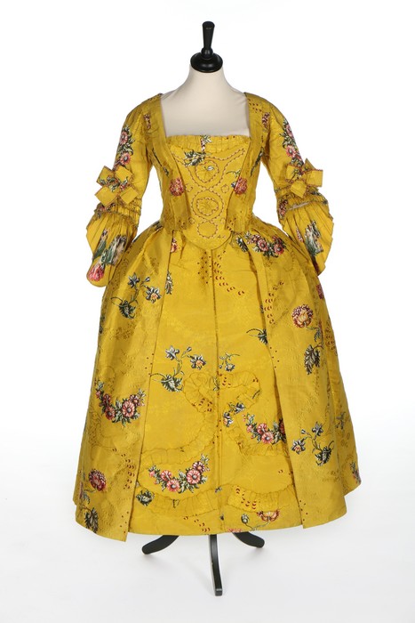 A fine brilliant yellow Spitalfields brocaded silk robe à l'Anglaise, circa 1750,