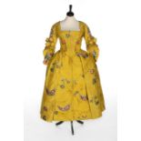 A fine brilliant yellow Spitalfields brocaded silk robe à l'Anglaise, circa 1750,