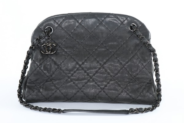 A Chanel dark grey leather shoulder bag, modern, stamped to interior, with three compartments,