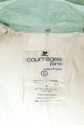 A Courrèges blue vinyl coat, 1970s, labelled Courrèges Paris B, with white pres-studs and tie belt, - Image 7 of 7