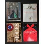 A group of fashion books,