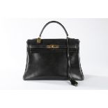 An Hermès black leather Kelly bag, 1950s-60s, stamped 'Hermès Paris' and with blind stamp P,