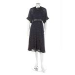 A Jean Muir navy chiffon and leather dress, 1970s, labelled, with punched leather bands, bust 92cm,