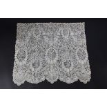 A deep Brussels mixed lace bonnet veil, circa 1860, with scalloped lower border,