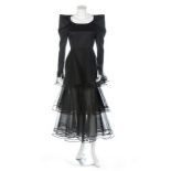 A Nina Ricci couture black satin gown, 1980s, labelled, with tiered tulle skirt,