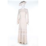 A Nina Ricci ivory crepe bridal gown and beret, circa 1970, labelled, 'Nina Ricci, Jeunes Femmes',