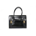 An Hermès black leather 'Drag' bag, 1960s, stamped 'Hermès Paris', with gilt 'H' lifter clasps,