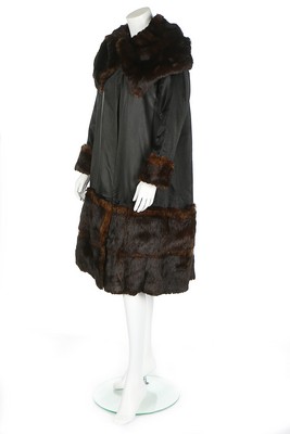 A rare and early Gabrielle Chanel black satin coat, circa 1918-20,