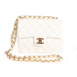 A Chanel quilted white leather bag, 1990s, Chanel stamp to the interior,