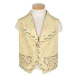 A primrose-yellow silk ribbon embroidered waistcoat, circa 1795, with broad lapels, small buttons,
