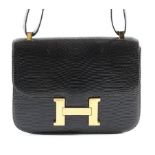 An Hermès dark brown lizard 'Constance' bag, 1980s, Varanus Salvator, stamped to the interior,
