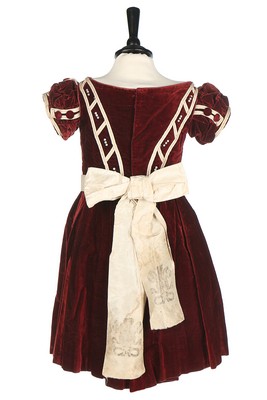 An unusual commemorative child's dress, 1863, of burgundy velvet with ivory satin piping, - Image 3 of 6