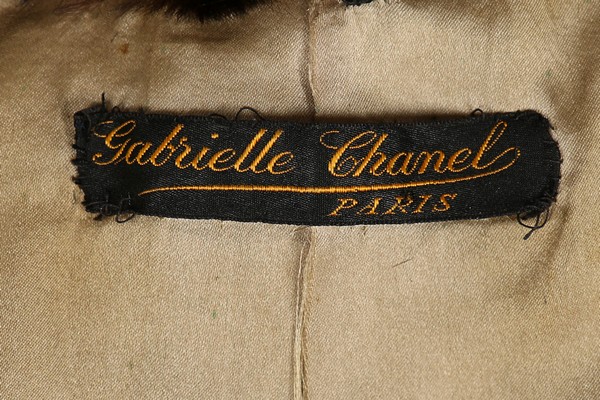 A rare and early Gabrielle Chanel black satin coat, circa 1918-20, - Image 7 of 8