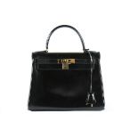 An Hermès black leather Kelly bag, 1987, stamped Hermès Paris, made in France,