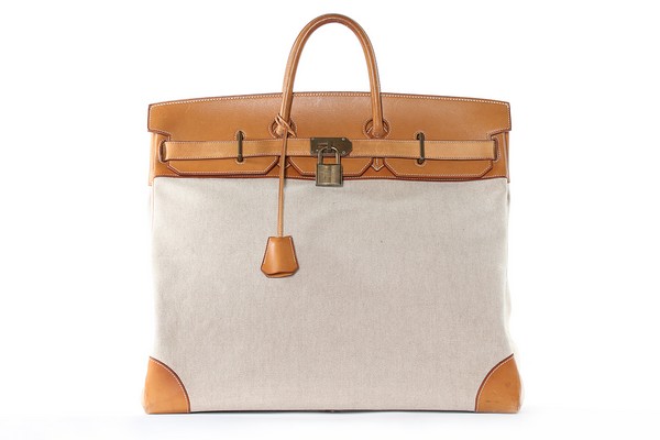 An Hermès Haut à Courroies overnight bag, 1990, blind stamp T, of canvas and tan leather,