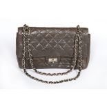A Chanel quilted brown leather flap bag, 1960s, stamped in gold to the interior 'Chanel',