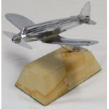 Plated model aircraft on marble base