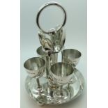 Silver egg cup nest with tea spoons